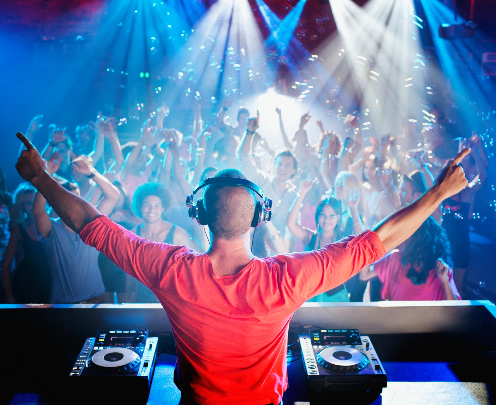 Energetic crowd enjoying nightclub music