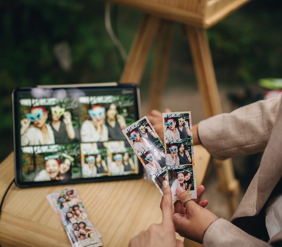 Tablet showing fun photo booth pictures