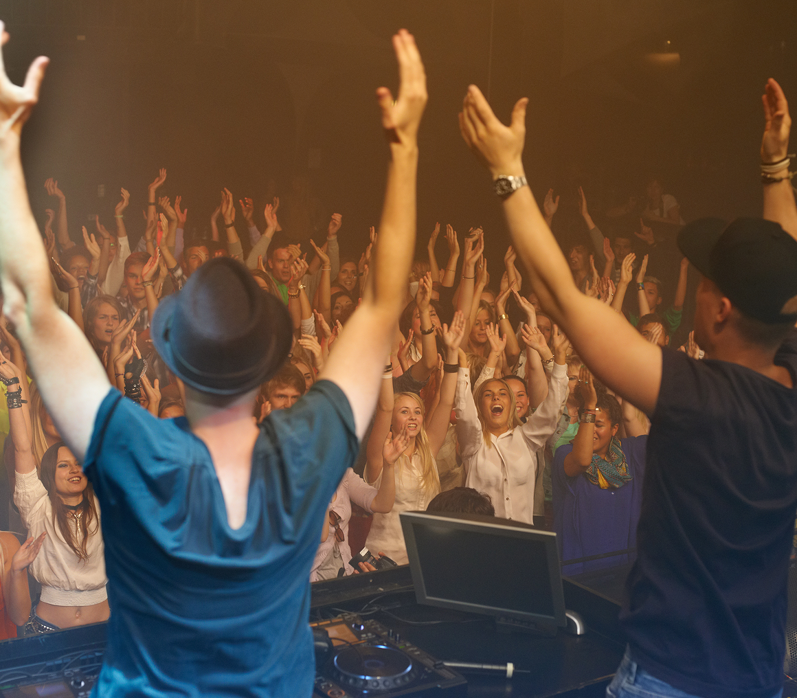 DJs performing for an excited crowd