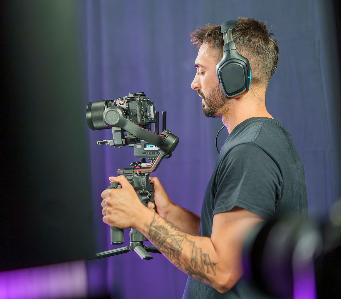 Man filming with professional equipment