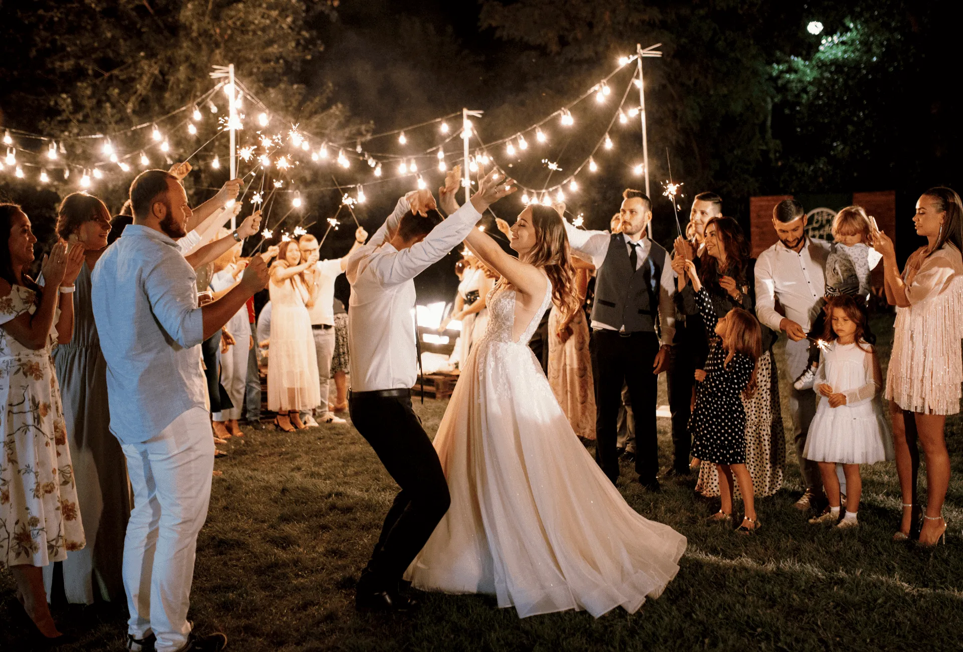 Guests celebrating at outdoor wedding reception