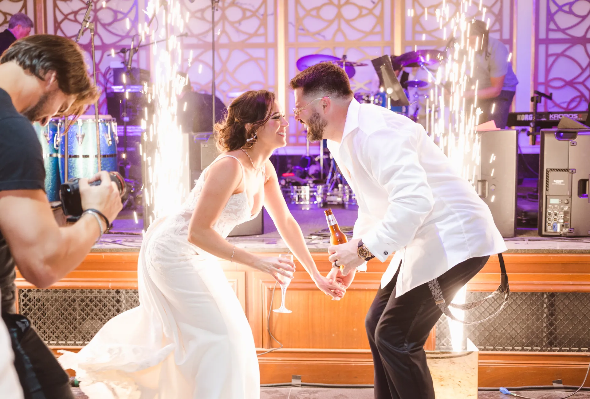 Bride and groom celebrating with sparklers