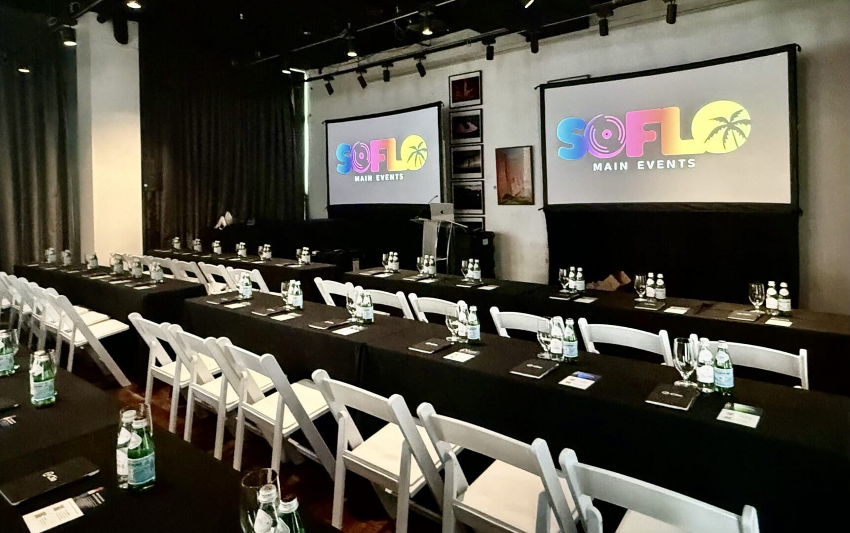 Conference setup with SOFLO branding displayed.