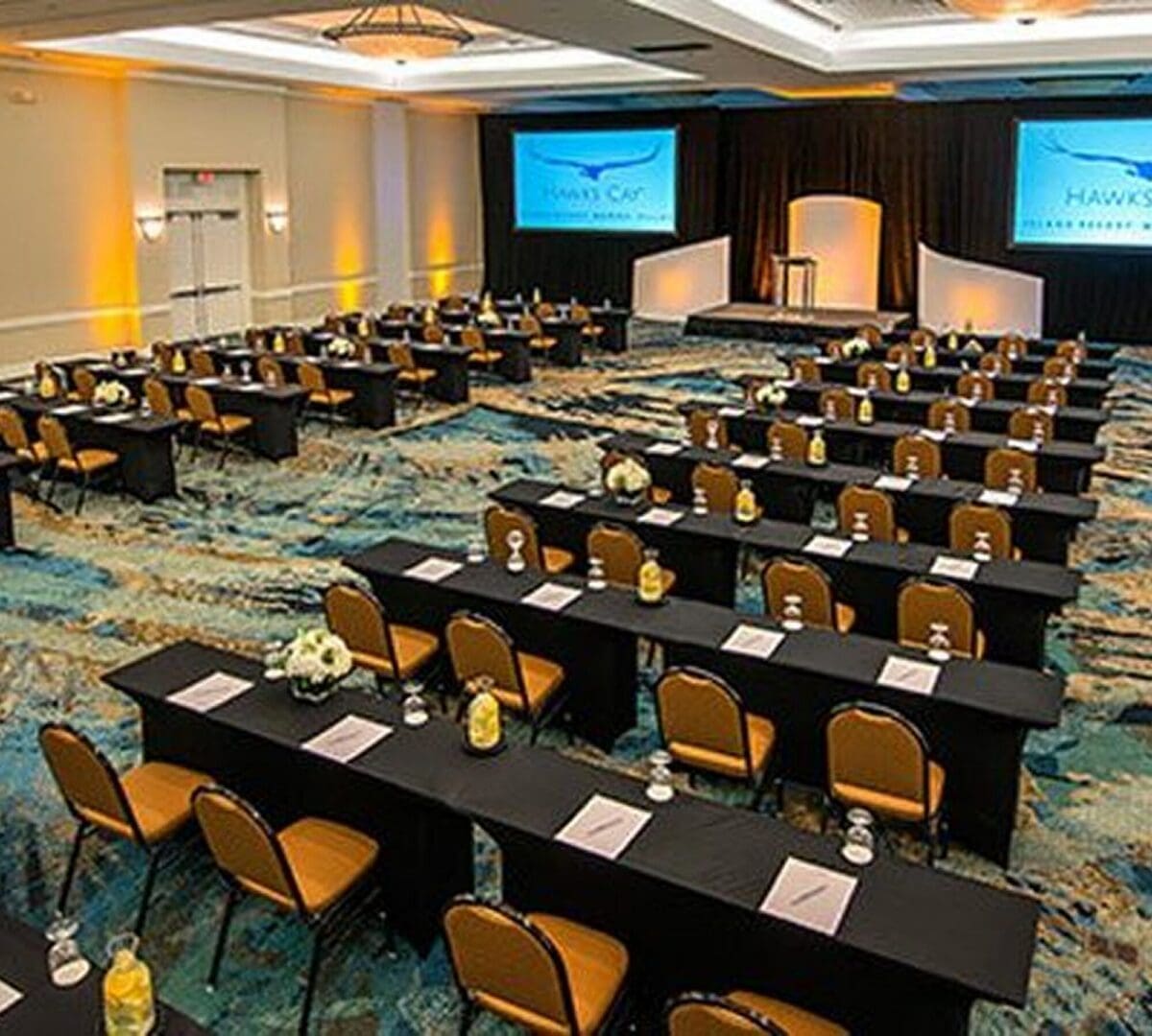 Conference room setup with tables and decor.