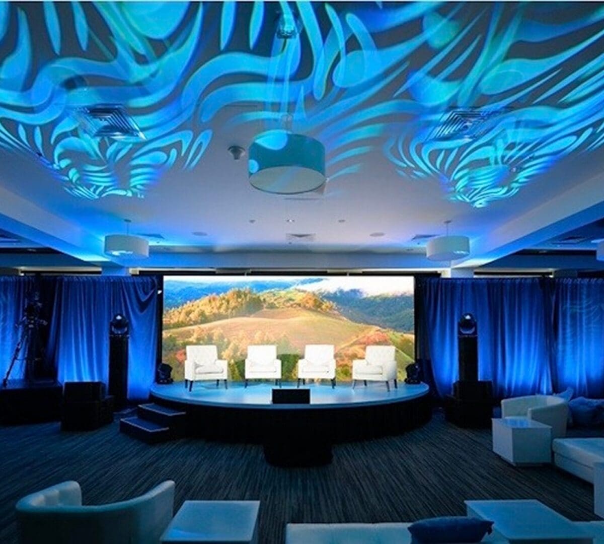 "Modern stage setup with blue lighting effects."